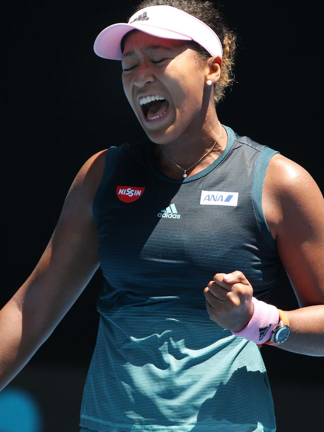 Naomi Osaka celebrates winning a big point. 