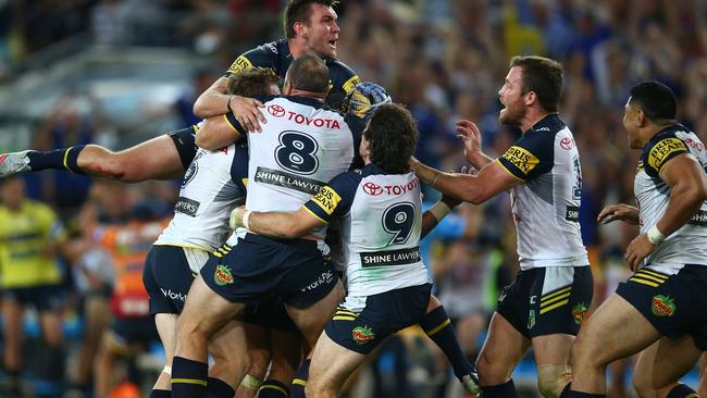 The Cowboys celebrate their grand final victory.