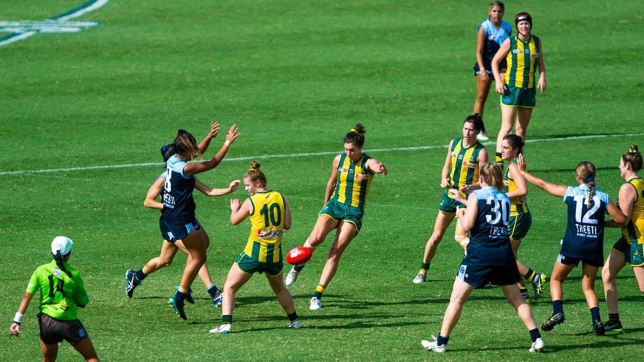 2020-21 NTFL Women's Premier League Grand Final - Darwin Buffettes v PINT Queenants. Jasmyn Hewett gets a boot to the ball under pressure. Photograph: Che Chorley