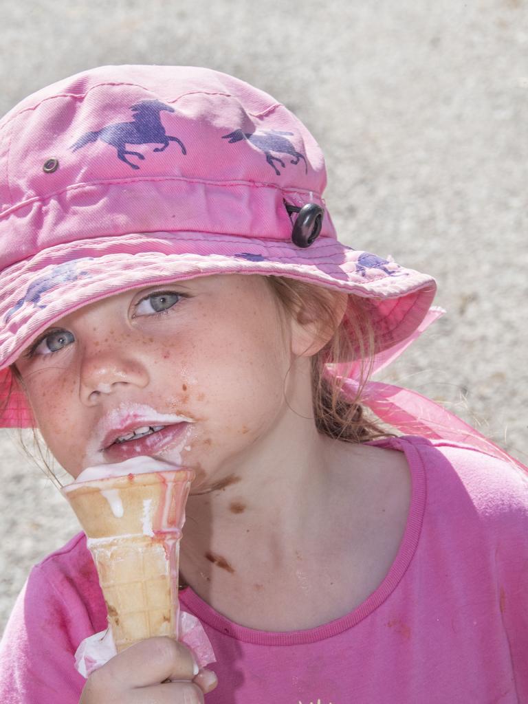 Maddie Patch 3yo enjoys an ice cream at the Toowoomba Royal Show. Picture: Nev Madsen