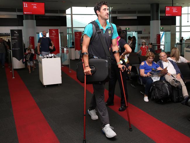 Injured cricketer Mitchell Starc arrives at Sydney Airport. Picture: Jane Dempster