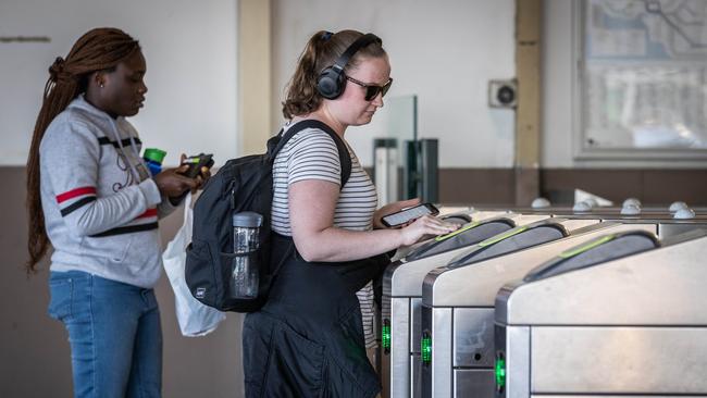 A NEW operator for Victoria's troubled Myki system will be announced today. Commuters use Myki cards at Flinders Street Station. Picture: Jake Nowakowski