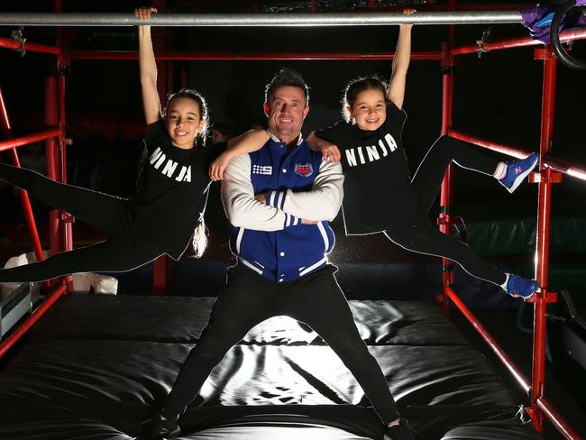 Fighting Lyons coach Paul Lyons, who died on September 8, is being remembered as “the ultimate motivator”. Pictured with Elite Ninja Kids Sienna, 12, and Tahlia, 7. Picture: George Salpigtidis