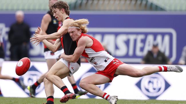 Clarence’s Ethan Jackson brings down North Launceston’s Michael Stingel. Picture: Zak Simmonds