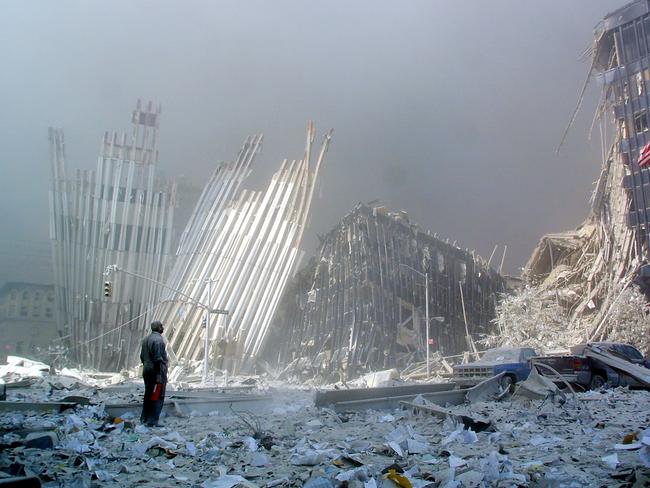 A man stands in the rubble, and calls out asking if anyone needs help, after the collapse of the first World Trade Center Tower in New York. Picture: AFP