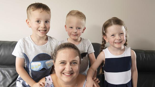 Fiona Lally with her four-year-old triplets Ashton, Zac and Izzy. Picture: Ellen Smith