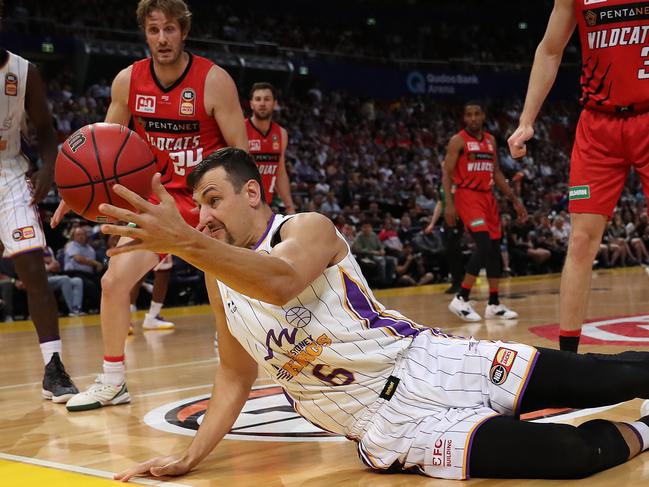 Andrew Bogut hits the floor in pursuit of the ball. Picture: Brett Costello