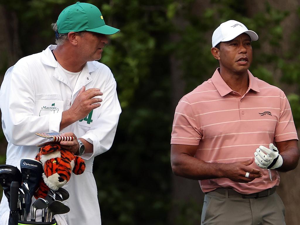 AUGUSTA, GEORGIA - APRIL 11: Tiger Woods of the United States looks on from the 11th fairway with his caddie, Lance Bennett, during the first round of the 2024 Masters Tournament at Augusta National Golf Club on April 11, 2024 in Augusta, Georgia. (Photo by Jamie Squire/Getty Images)