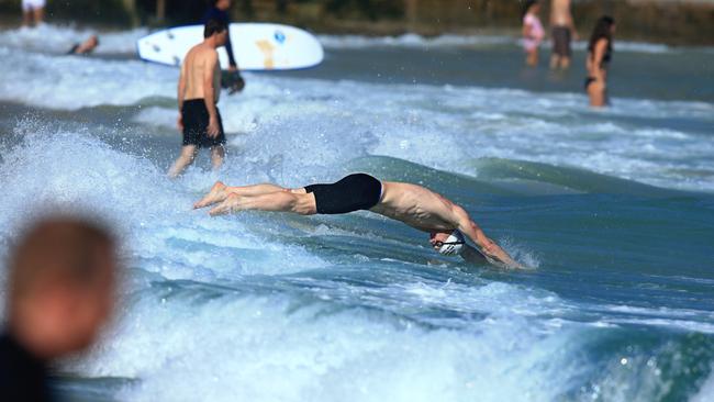 Bondi and North Bondi surf lifesaving clubs face off in the 75th annual Stan and Basil McDonald Memorial Relay. Photo: Jenny Evans