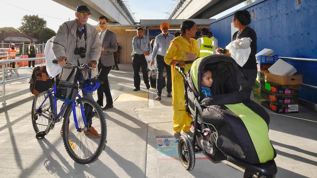 Commuters arrive at the new train station. Picture: Jason Edwards