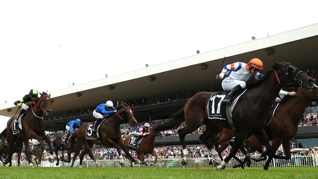 Think About It (left) finishes fifth behind Veight (orange cap) in the George Ryder Stakes.