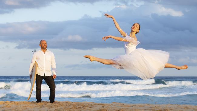 Surfing legend Tom Carroll with his daughter, Grace Carroll, on Curl Curl Beach. Picture: Justin Lloyd.