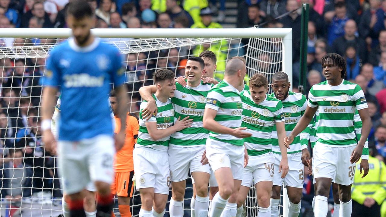 Tom Rogic celebrates with colleagues.