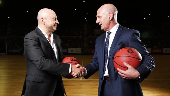 NBL owner and executive chairman Larry Kestelman and Tasmanian Premier Peter Gutwein shake hands after announcing the league’s 10th team would be based in Tasmania. Picture: Zak Simmonds