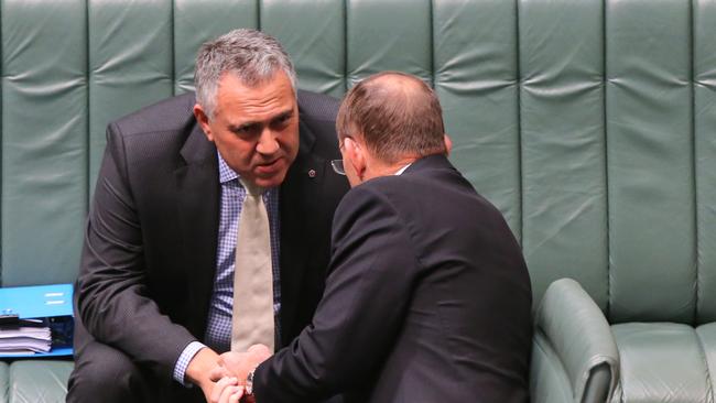 Treasurer Joe Hockey and PM Tony Abbott before Question Time in the House of Representatives Chamber, at Parliament House in Canberra