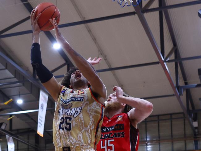 Pinder of the Taipans drives to the basket against the Perth Wildcats. Picture: Graham Denholm/Getty Images.