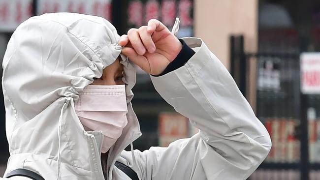 A woman wearing a face mask as a precaution against COVID-19. Picture: AFP