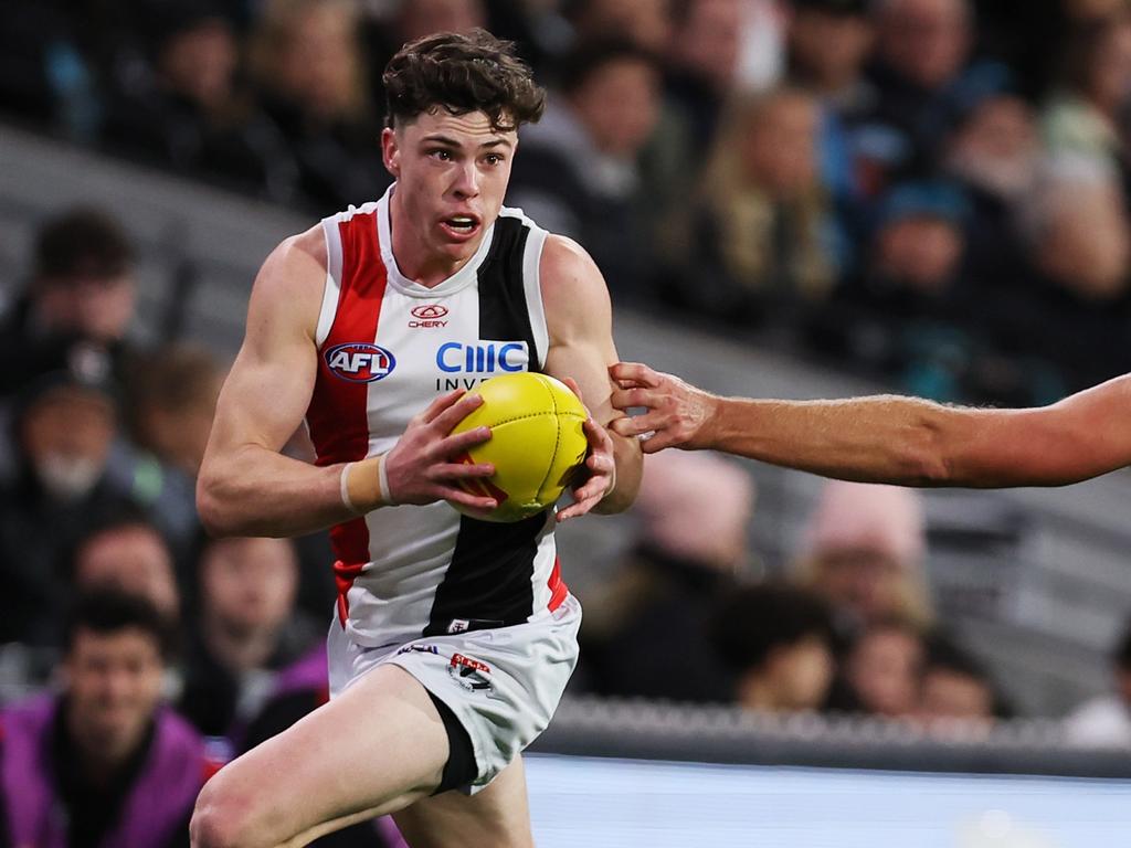 Darcy Wilson of the Saints is tackled by Dan Houston of the Power during the 2024 AFL Round 07 match. (Photo by James Elsby/AFL Photos via Getty Images)