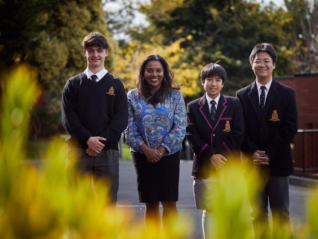 Finnian Egan (Year 11), Mrs Ganga Fraser, Lincoln Lam (Year 8) and Gus Rienchalanusarn (Year 11) on campus at The Hutchins School.