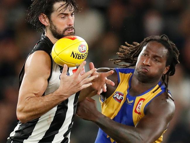 MELBOURNE, AUSTRALIA - APRIL 09: Brodie Grundy of the Magpies and Nic Naitanui of the Eagles compete for the ball during the 2022 AFL Round 04 match between the Collingwood Magpies and the West Coast Eagles at Marvel Stadium on April 09, 2022 In Melbourne, Australia. (Photo by Michael Willson/AFL Photos via Getty Images)