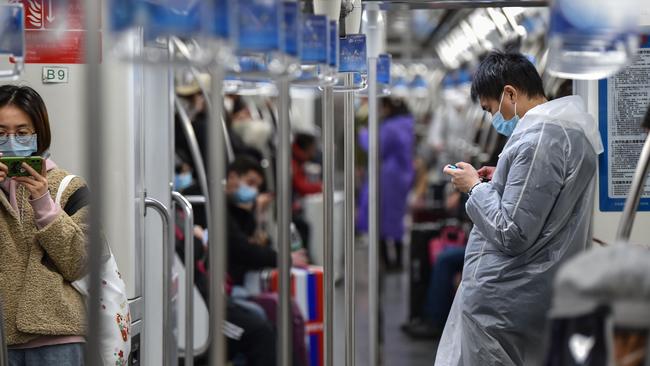 Passengers travel on a subway train in Shanghai on March 5 as China on March 5 reported 31 more deaths coronavirus, taking the country's overall toll past 3000. Picture: Hector Retamal/AFP