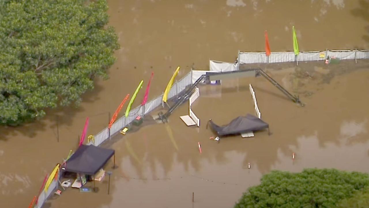 Flood water rises over what was to be Strathpine Magical Christmas Festival. Photo: 7News Brisbane