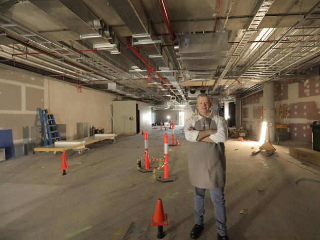 Shannon Kellam in what will be the large kitchen area of his new restaurant Mica at the new Mercedes-Benz dealership at Newstead. Picture: Mark Cranitch