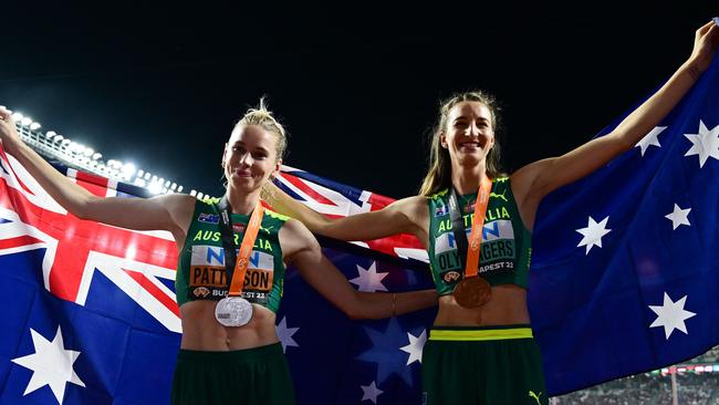 Silver medallist Eleanor Patterson (left) and bronze medallist Nicola Olyslagers celebrate after the women's high jump final. Picture: AFP