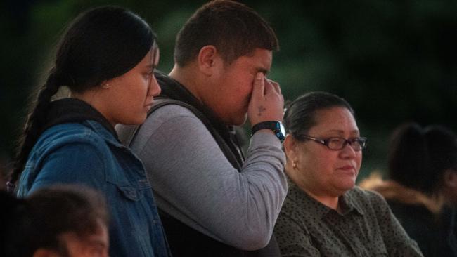 Mourners gather at the site where Solomone was killed. Picture: Tony Gough