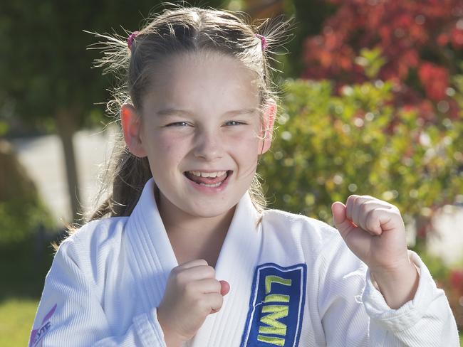 Pic of nine year old Jiu Jitsu sports star Jayda Golding.  grappling with her older brother Nathan, she mostly takes on and beats boys.Picture:Rob Leeson.