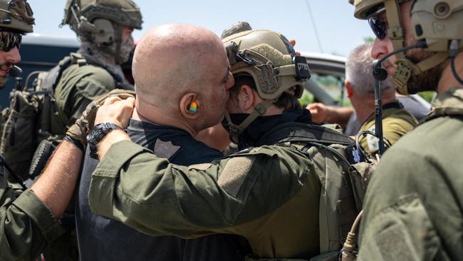 Shlomi Ziv, 41-years-old, kissing a soldier after his rescue from the Gaza Strip. Picture: AFP