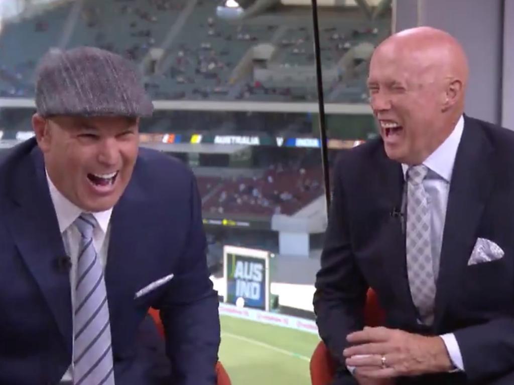 Shane Warne explodes with laughter.