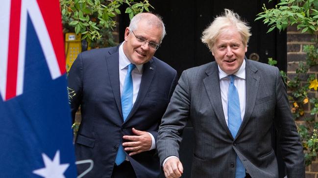 Scott Morrison and Boris Johnson announce the free trade agreement at 10 Downing Street. Picture: AFP)