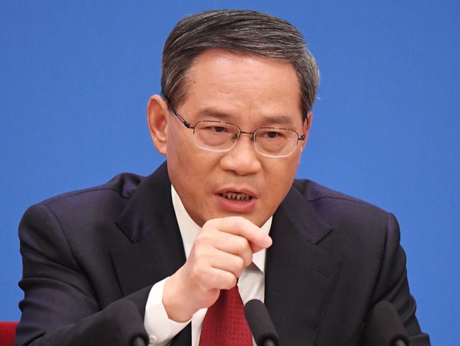 (FILES) China's Premier Li Qiang speaks during a press conference after the closing session of the National People's Congress (NPC) at the Great Hall of the People in Beijing on March 13, 2023. China's Premier Li Qiang will attend the G20 summit in the Indian capital New Delhi this weekend, a Beijing foreign ministry spokeswoman said on September 4, 2023. (Photo by GREG BAKER / AFP)