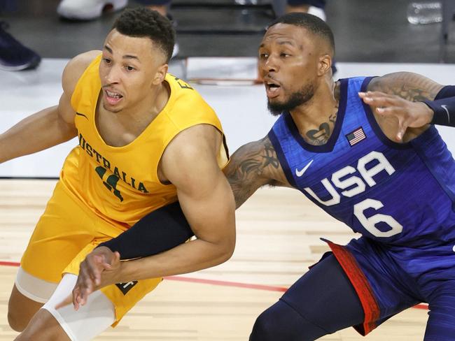 LAS VEGAS, NEVADA - JULY 12:  Dante Exum #11 of the Australia Boomers drives against Damian Lillard #6 of the United States during an exhibition game at Michelob Ultra Arena ahead of the Tokyo Olympic Games on July 12, 2021 in Las Vegas, Nevada. Australia defeated the United States 91-83.  (Photo by Ethan Miller/Getty Images)