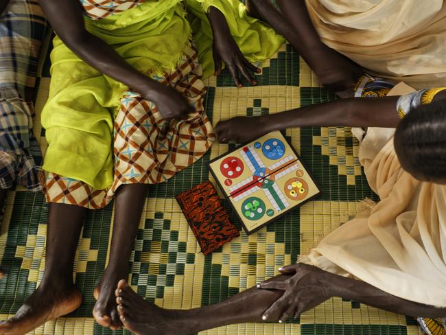 South Sudanese refugee women who suffered sexual or other gender-based violence play a board game at a women’s centre run by the aid group International Rescue Committee, in Bidi Bidi, Uganda. Picture: Ben Curtis/AP