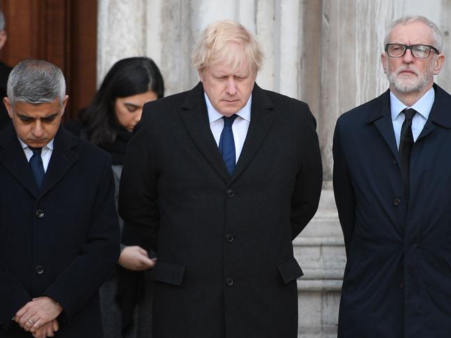 London mayor Sadiq Khan, Britain's Prime Minister Boris Johnson and opposition Labour Party leader Jeremy Corbyn take part in a vigil at the Guildhall in London. Picture: AFP