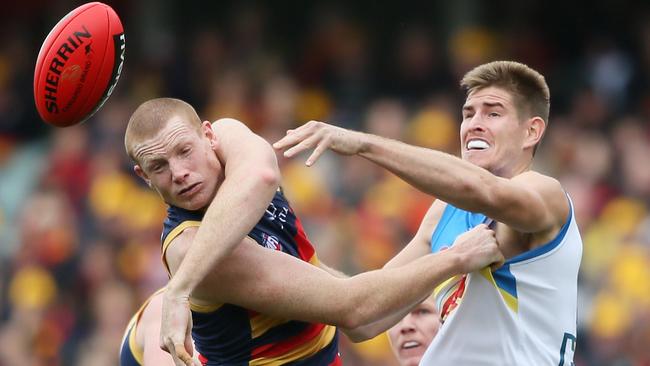 Sam Jacobswins the tap ahead of the Suns’ Zac Smith. Picture: Ben Macmahon (AAP)