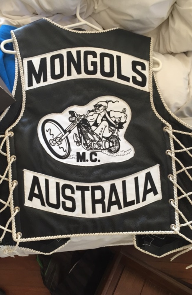 Cash, drugs and Mongols bikie colours found in a Biggera Waters raid. Photos: Supplied.