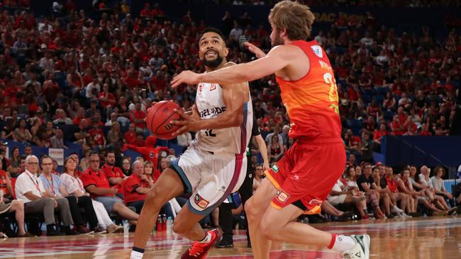 Adelaide’s Daniel Dillon drives to the basket against Perth’s Jesse Wagstaff on Sunday night. Picture: Paul Kane/Getty Images