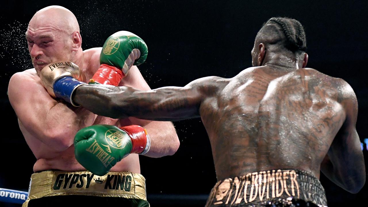 Deontay Wilder punches Tyson Fury during their first fight in December 2018. Photo: Harry How/Getty Images/AFP