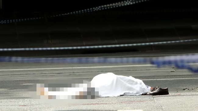 The body of victim and beloved restaurateur Sisto Malaspina lies in Bourke St after the horrific attack. Photo: Robert Cianflone/Getty Images