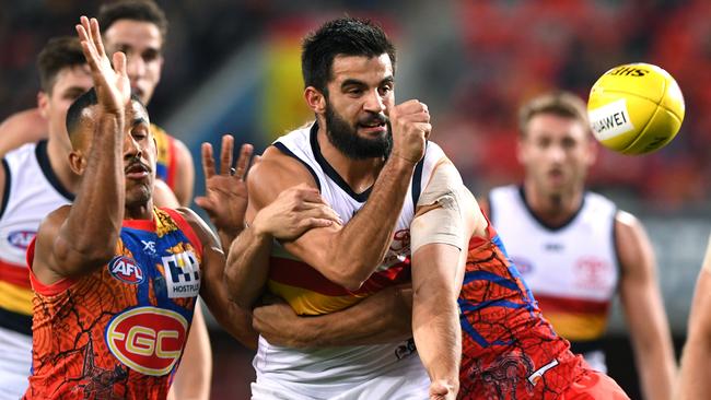 Wayne Milera of the Crows handballs during the win against Gold Coast.