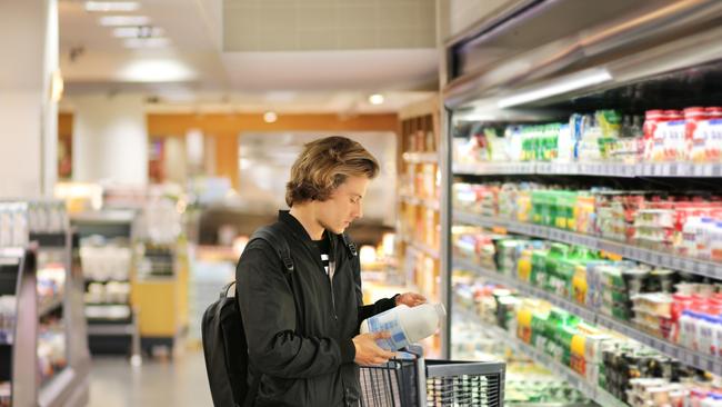 man choosing a dairy products at supermarket Picture: Istock