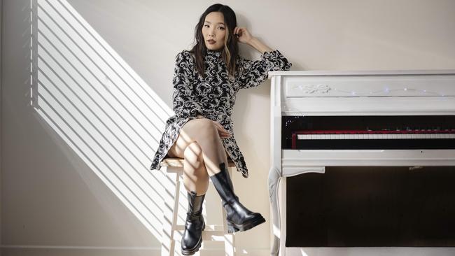 Chart-topping singer-songwriter Dami Im, at her home in Brisbane, kicks off our second Isolation Room series of songs to lift the spirits of everyone in lockdown. Picture: Glenn Hunt