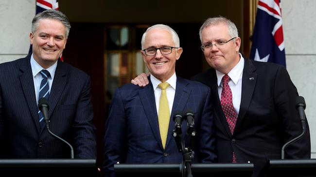 Malcolm Turnbull flanked by Mathias Cormann, left, and Scott Morrison in Canberra this week. Picture: Kym Smith