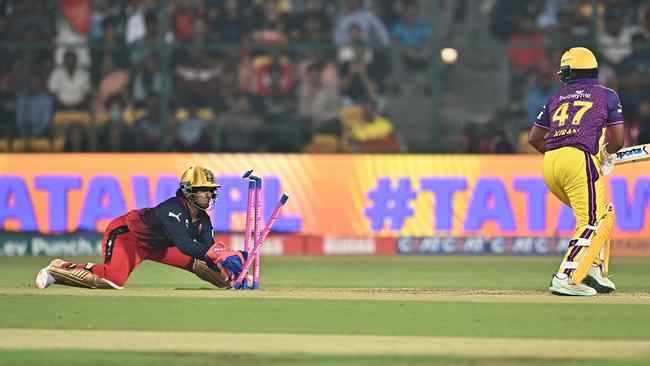 Royal Challengers Bangalore's wicket keeper Richa Ghosh (L) stumps the wicket of UP Warriorz's Kiran Navgire (R) during the Women's Premier League (WPL) Twenty20 cricket match between Royal Challengers Bangalore and UP Warriorz at the Chinnaswamy Stadium in Bengaluru on February 24, 2024. (Photo by Idrees MOHAMMED / AFP)