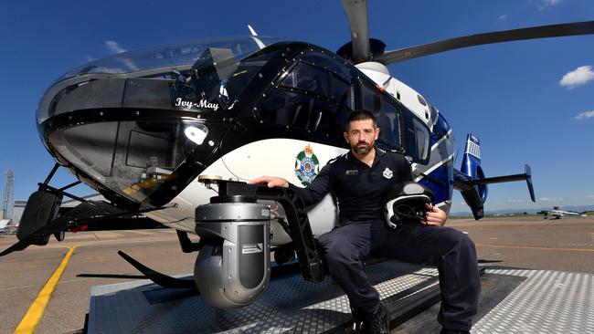 Townsville Tactical Crime Squad Senior Constable John Robinson is an observer on Townsville's police chopper, the eye in the sky in the fight against youth crime. Picture: Evan Morgan