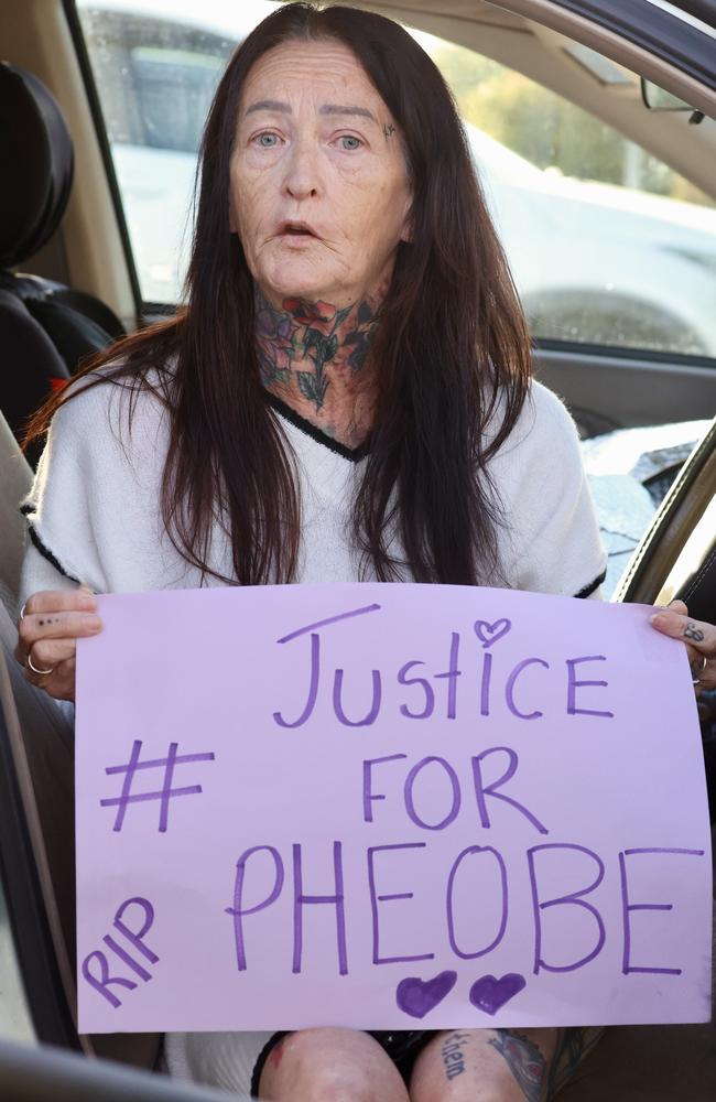 Mandy Louise Hart with her sign outside Bundaberg Courthouse. Picture: Liam Kidston