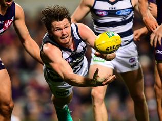 PERTH, AUSTRALIA - JULY 15: Patrick Dangerfield of the Cats dives in a handball during the 2016 AFL Round 17 match between the Fremantle Dockers and the Geelong Cats at Domain Stadium on July 15, 2016 in Perth, Australia. (Photo by Daniel Carson/AFL Media/Getty Images)